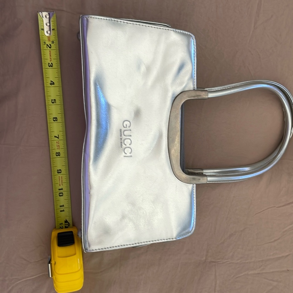 Gucci metallic silver purse.. very cute and stylish.